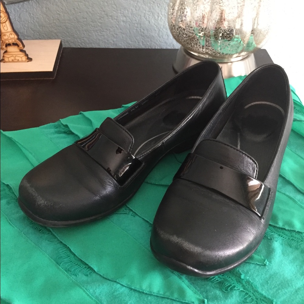 Black leather Dansko loafers.
